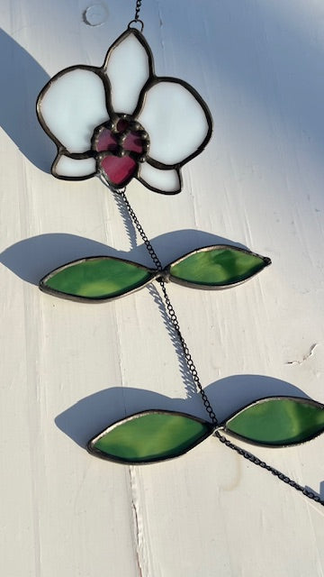 Stained Glass White Orchid Suncatcher – Pink Center Flower, Black Chain Movement Leaves, Black Patina, Handmade USA Botanical Window Art