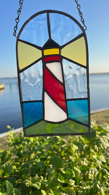 Stained Glass Lighthouse Suncatcher – Red &amp; White Coastal Beacon with Iridescent Blue Waves – Nautical Window Hanging