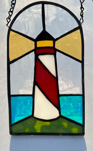 Stained Glass Lighthouse Suncatcher – Red &amp; White Coastal Beacon with Iridescent Blue Waves – Nautical Window Hanging