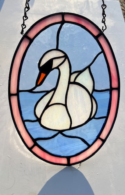 Iridescent Swan Stained Glass Suncatcher – Elegant Bird Window Hanging – Handmade Oval Glass Art with Soft Pink Border